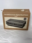 7-4625 Digital Alarm Clock Radio Am/fm General Electric Wood Grain Spacesaver. Fixed Price $99.00.